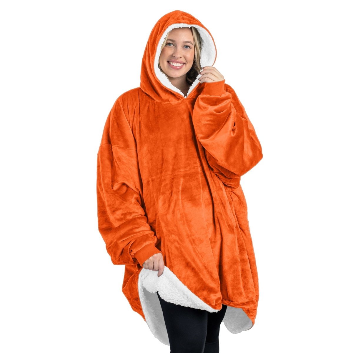 An adult with a sherpa wearable blanket on