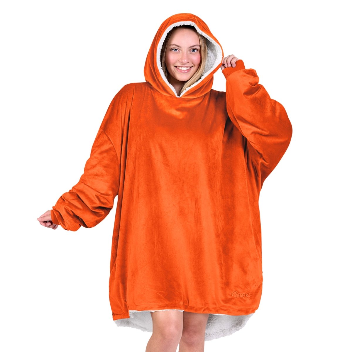An adult with a sherpa wearable blanket on