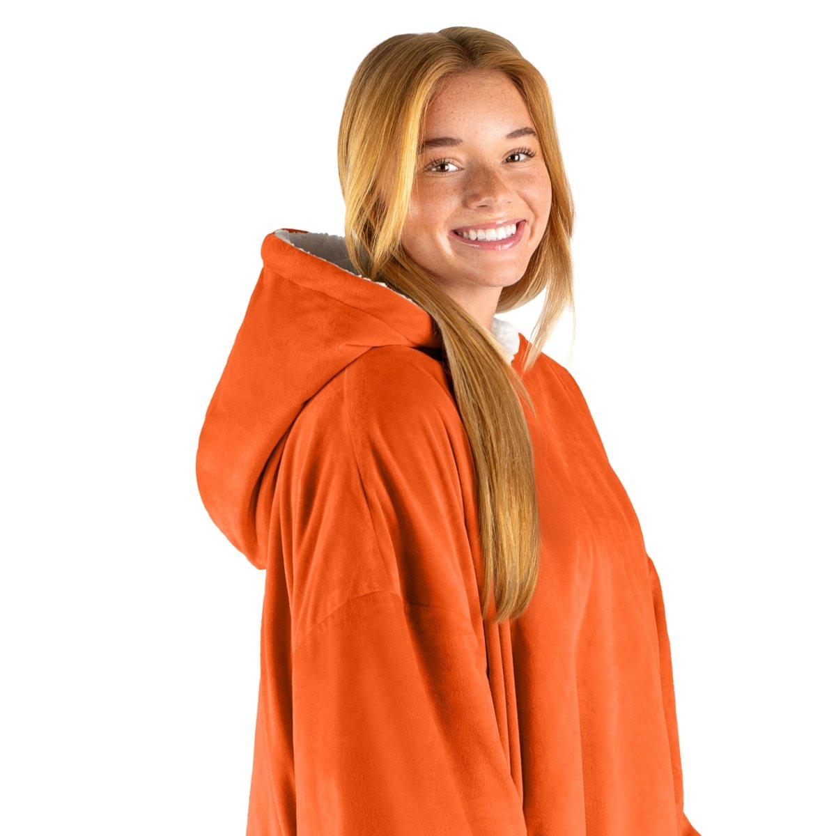 An adult with a hooded wearable blanket on