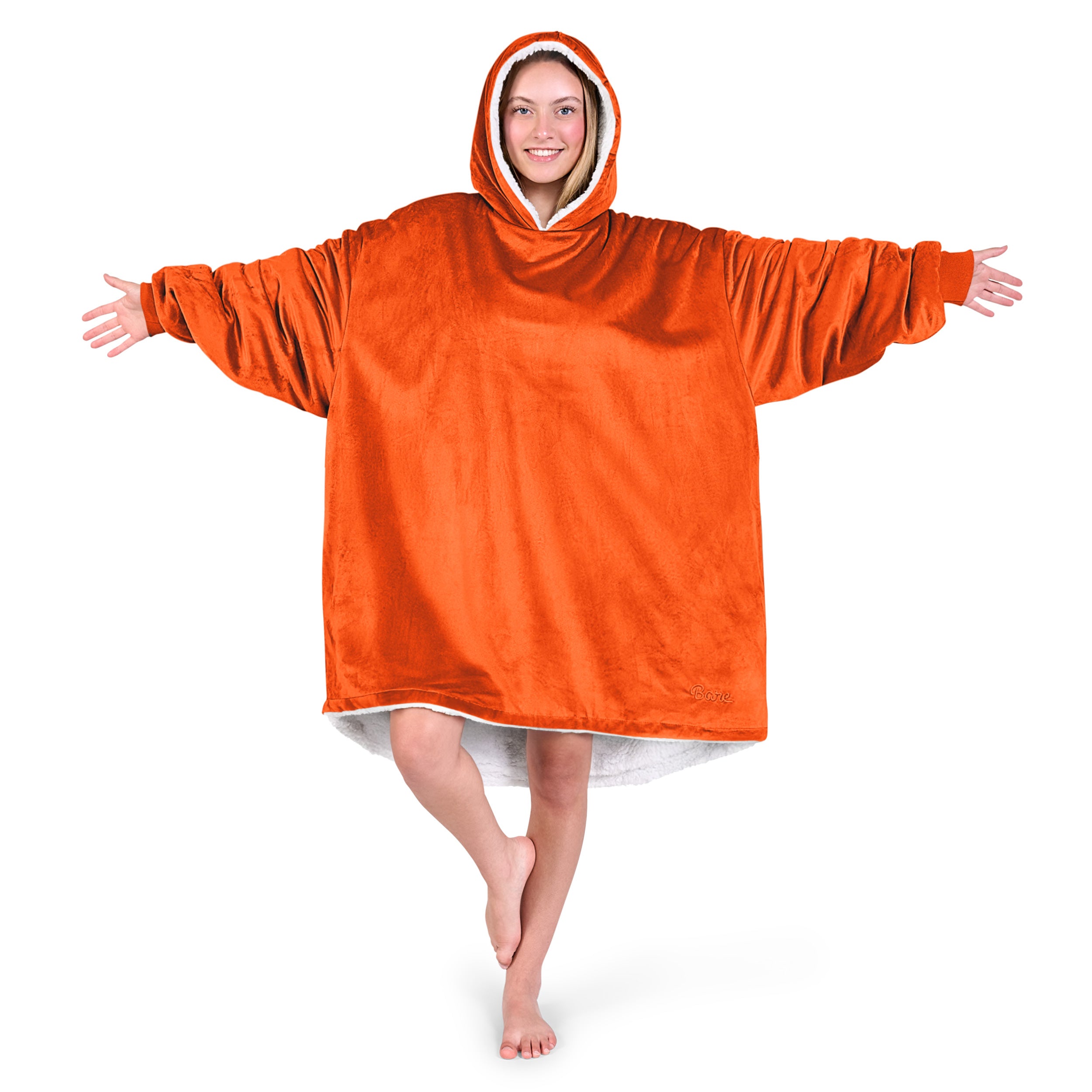 An adult with a sherpa wearable blanket on