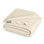 A cotton waffle blanket folded