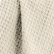 Close up of the fabric of a cotton waffle blanket