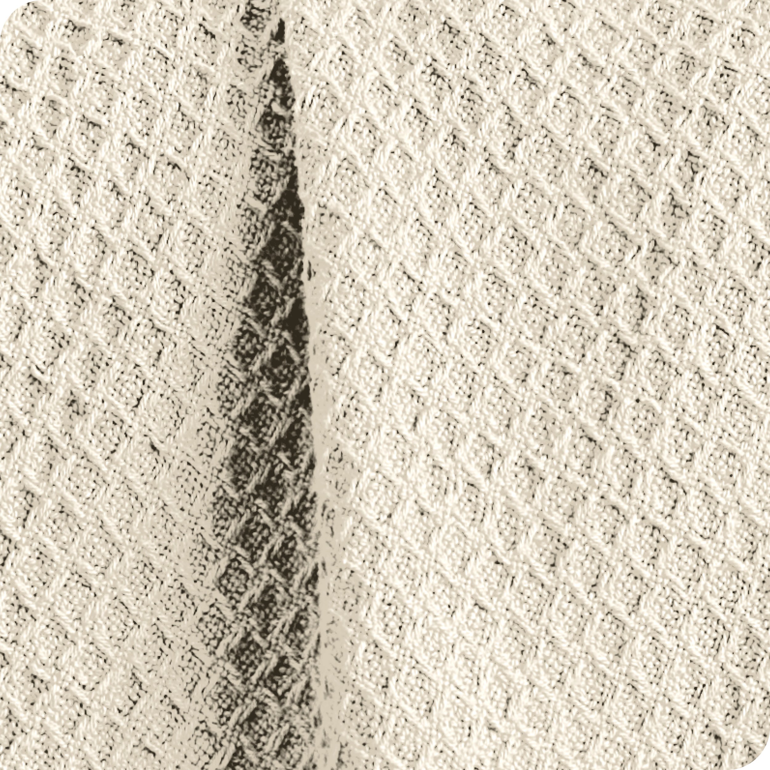 Close up of the fabric of a cotton waffle blanket