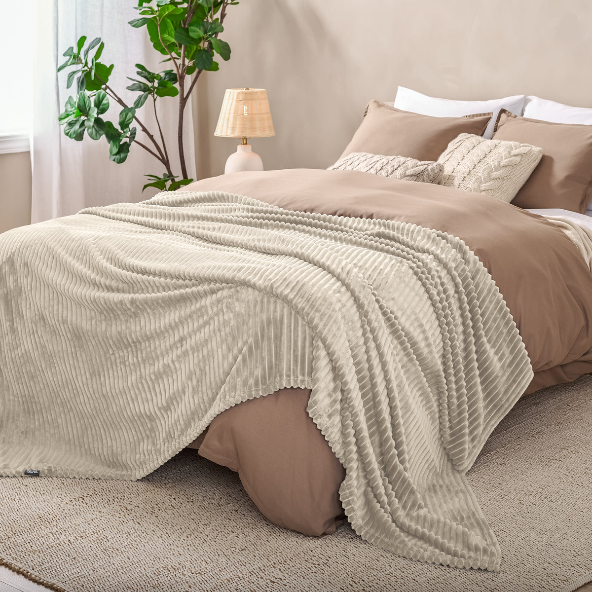 Microplush ribbed blanket on a bed