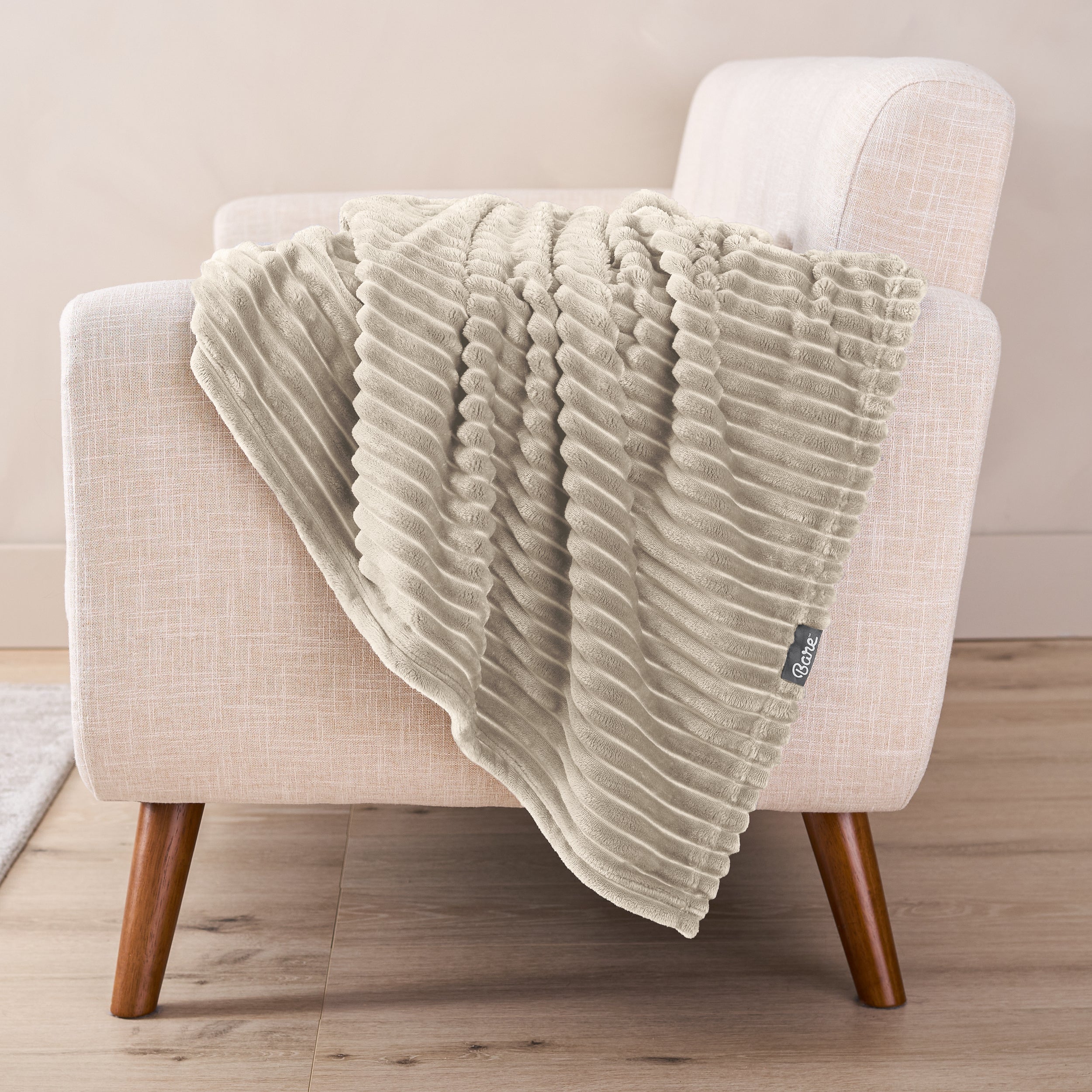 A microplush blanket draped over a chair