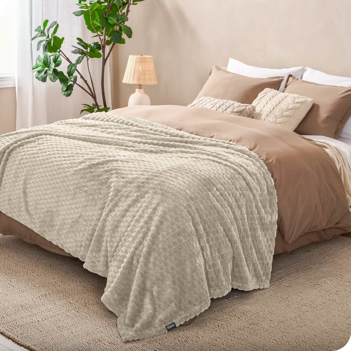 Microplush waffle blanket on a bed
