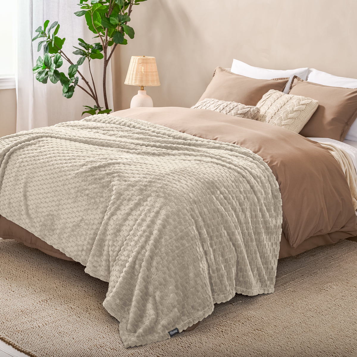 Microplush waffle blanket on a bed