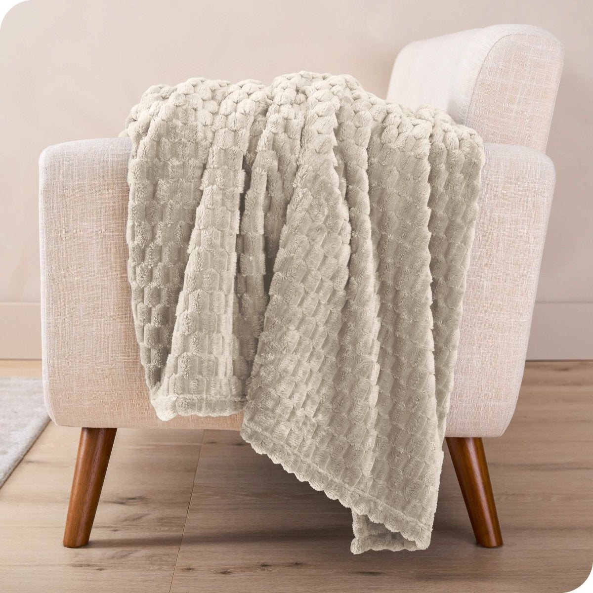 A microplush blanket draped over a chair