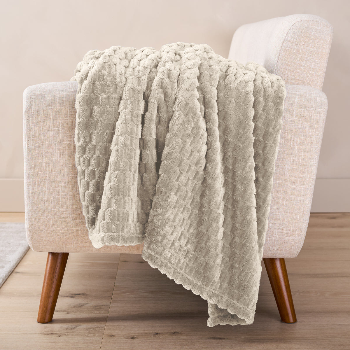 A microplush blanket draped over a chair
