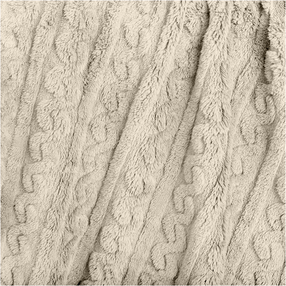 Close-up of a textured blanket with a cable knit pattern