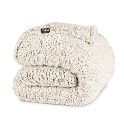 Folded sherpa blanket with a Bare label on a white background