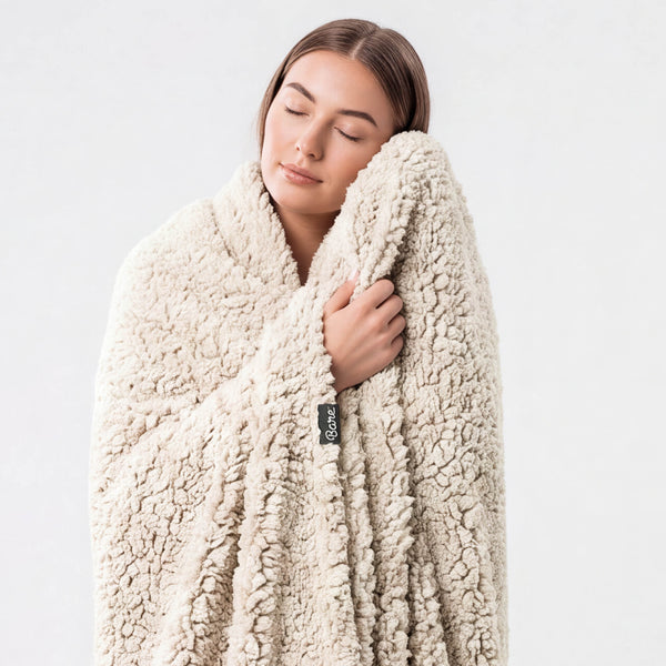A woman wrapped in a blanket