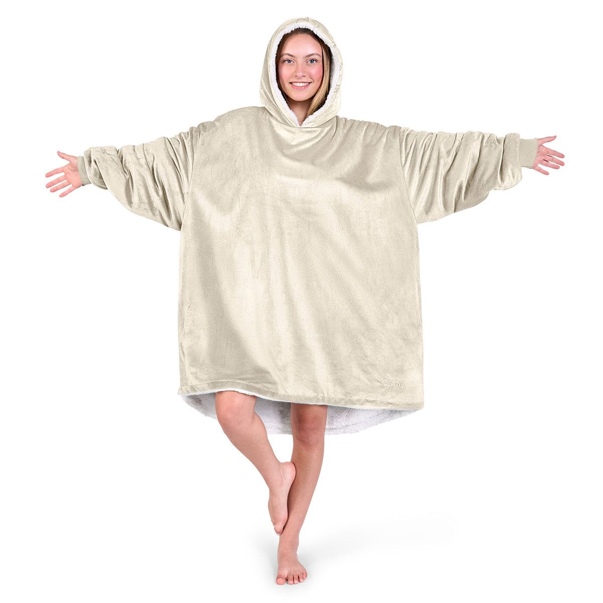 An adult with a sherpa wearable blanket on