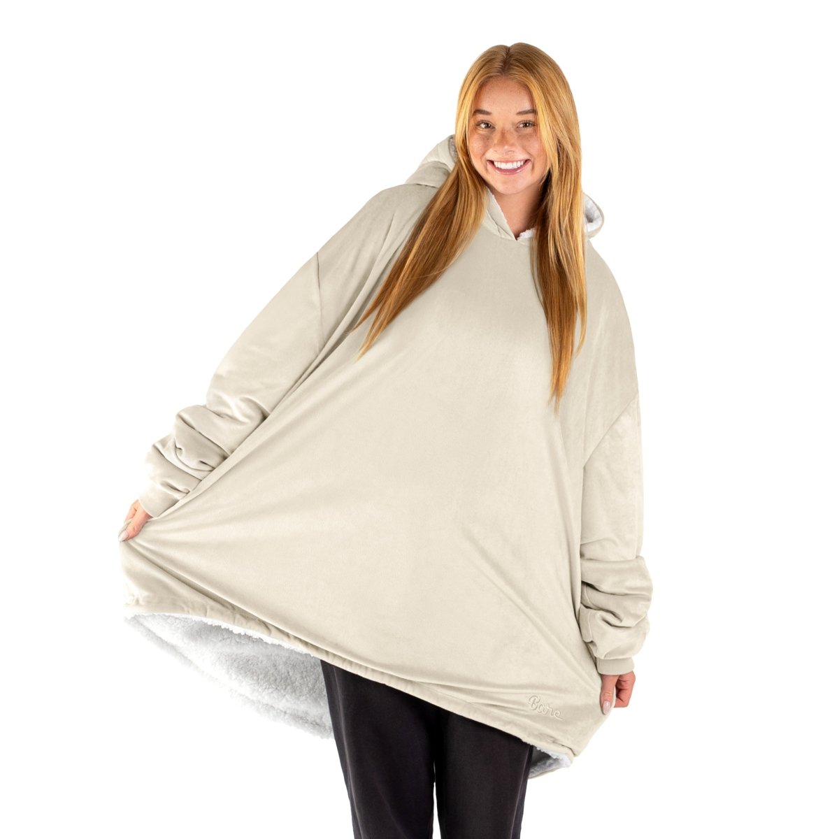 An adult with a sherpa wearable blanket on