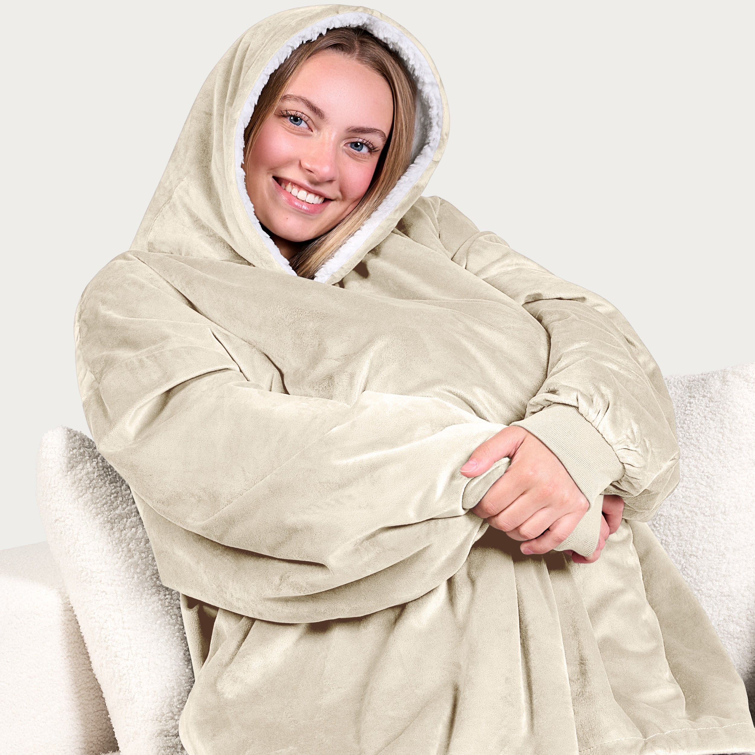 An adult with a sherpa wearable blanket on