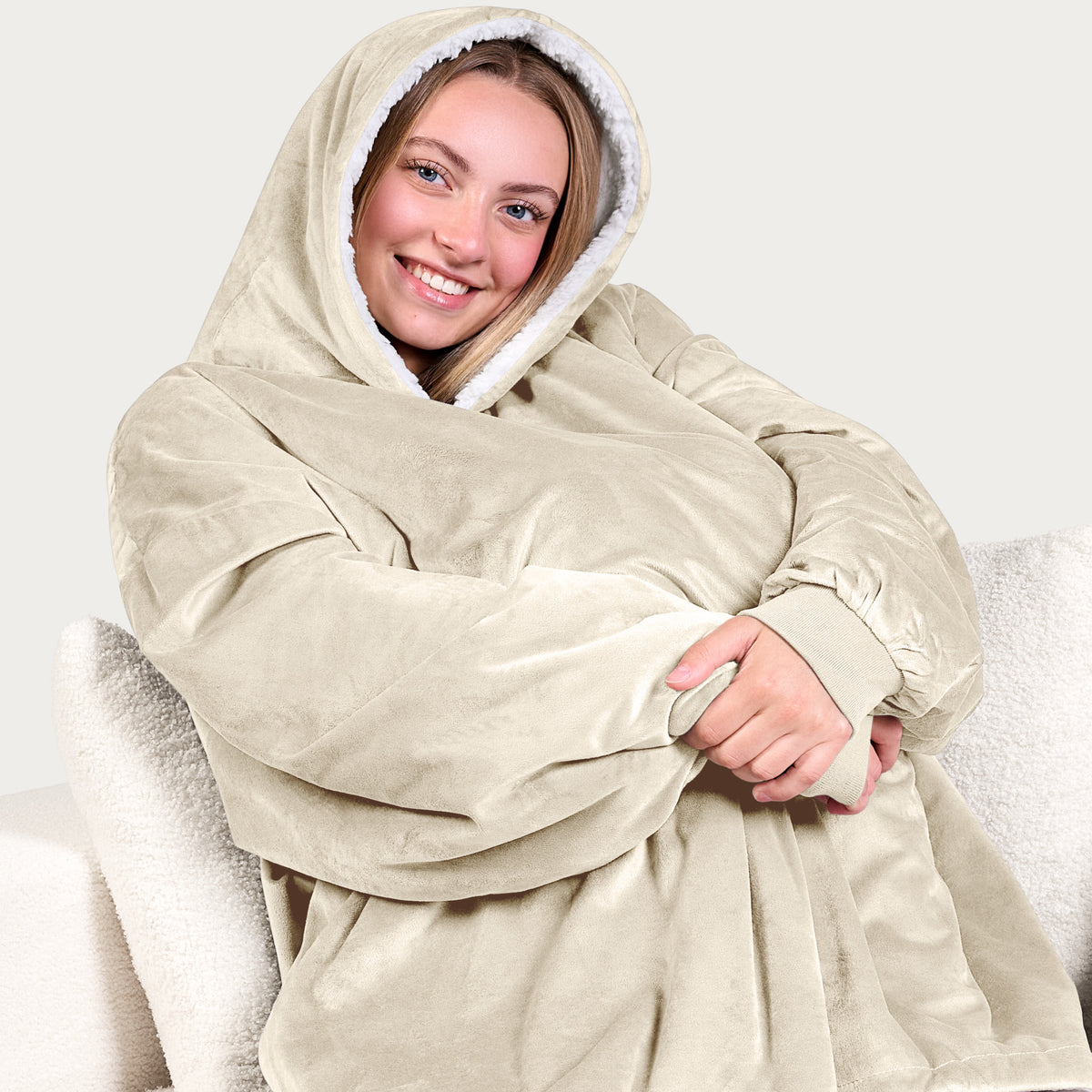 An adult with a sherpa wearable blanket on