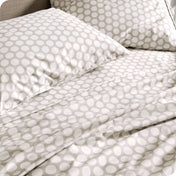 Close up of a printed sheet set on a mattress