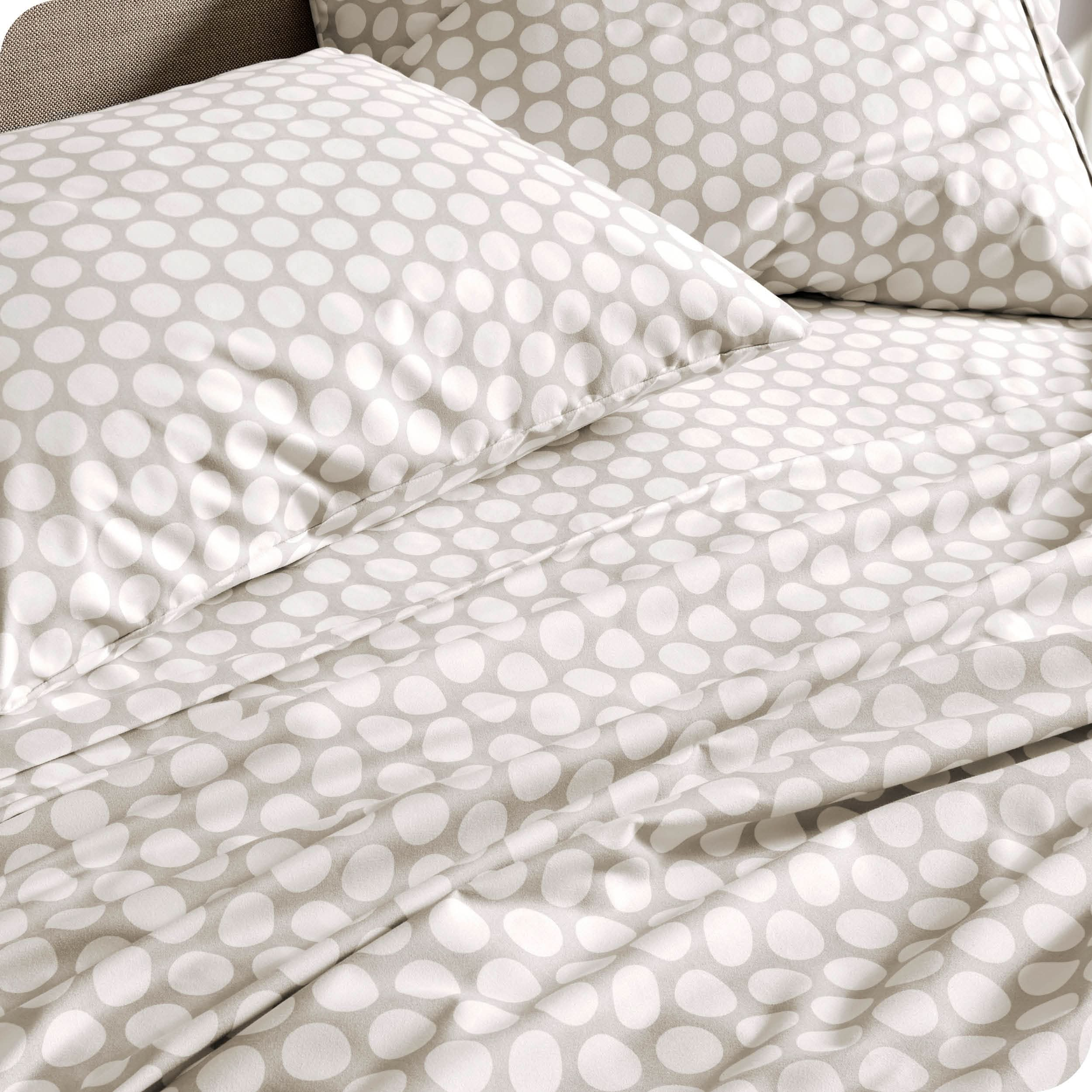 Close up of a printed sheet set on a mattress