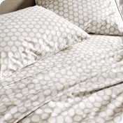 Close up of a printed sheet set on a mattress