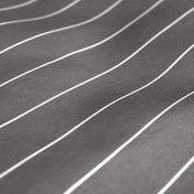 A close-up of dark gray fabric with thin white pinstripes