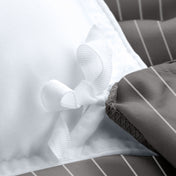 Close-up of a pinstripe duvet cover with corner ties