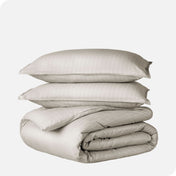 A duvet cover set folded and stacked