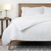 White bedding set with thin blue vertical pinstripes