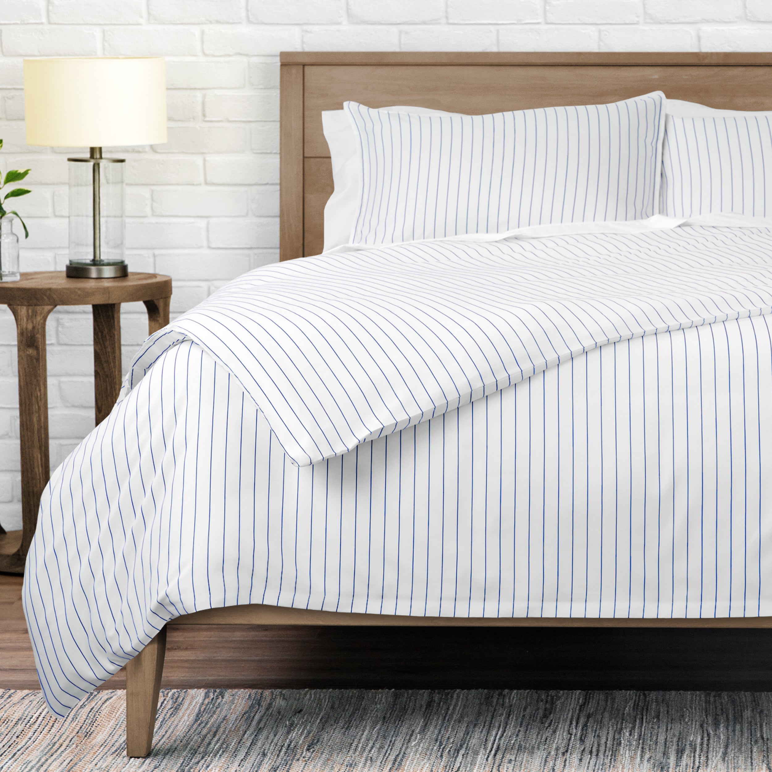 White bedding set with thin blue vertical pinstripes