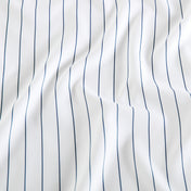 White fabric with thin vertical navy blue pinstripes