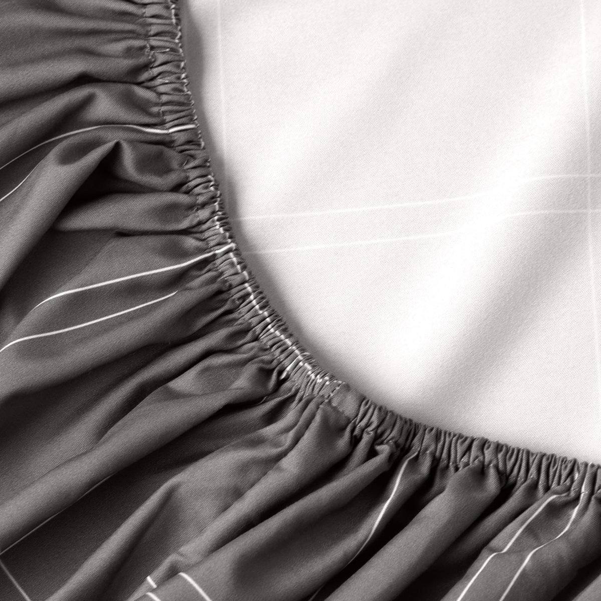 Close-up of fitted sheet with all around elastic