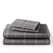 Plaid sheet set folded and stacked