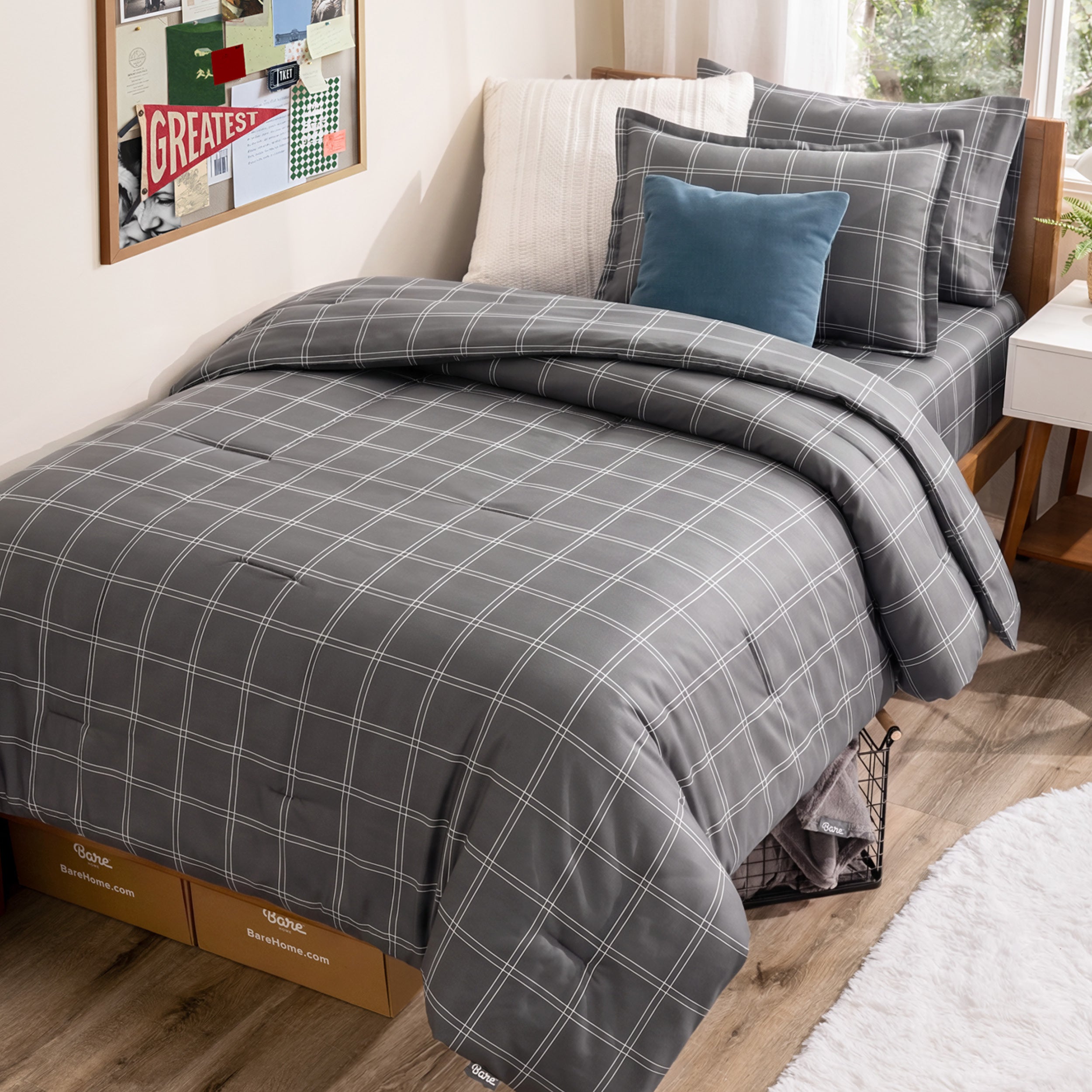 Plaid bedding set in a dorm room