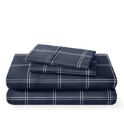 Plaid sheet set folded and stacked