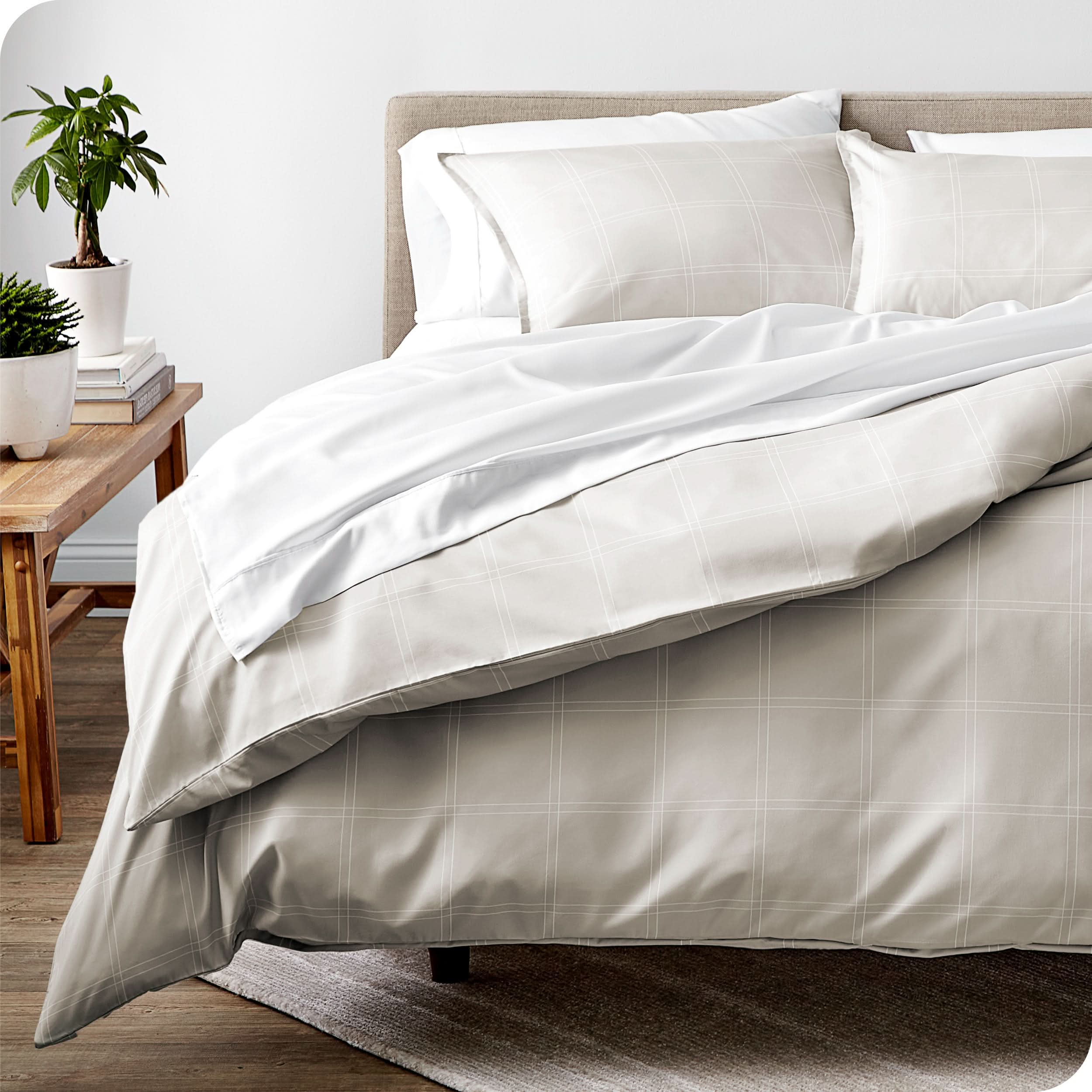 Relaxing room scene showing a printed duvet cover laid out over the bed