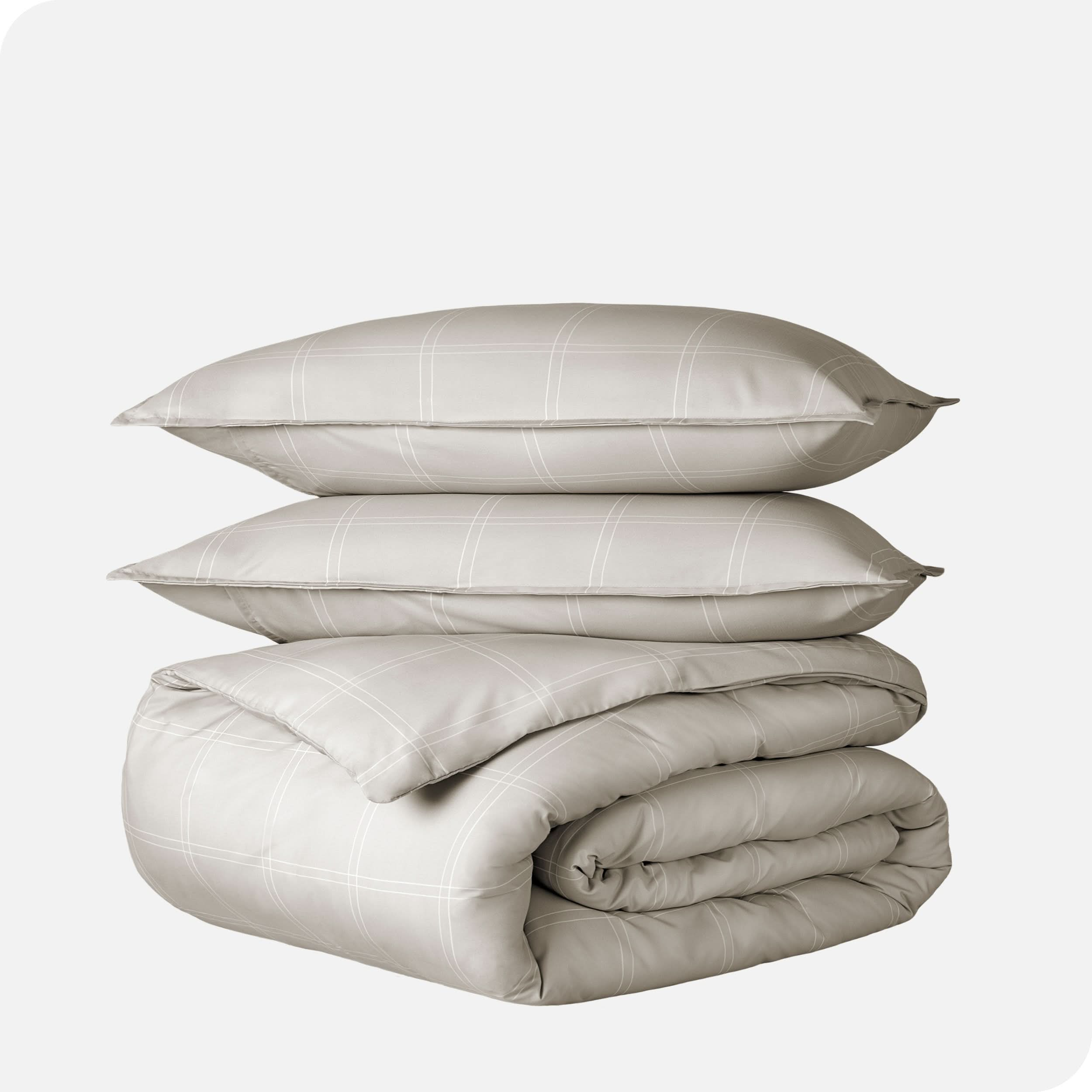 A duvet cover set folded and stacked