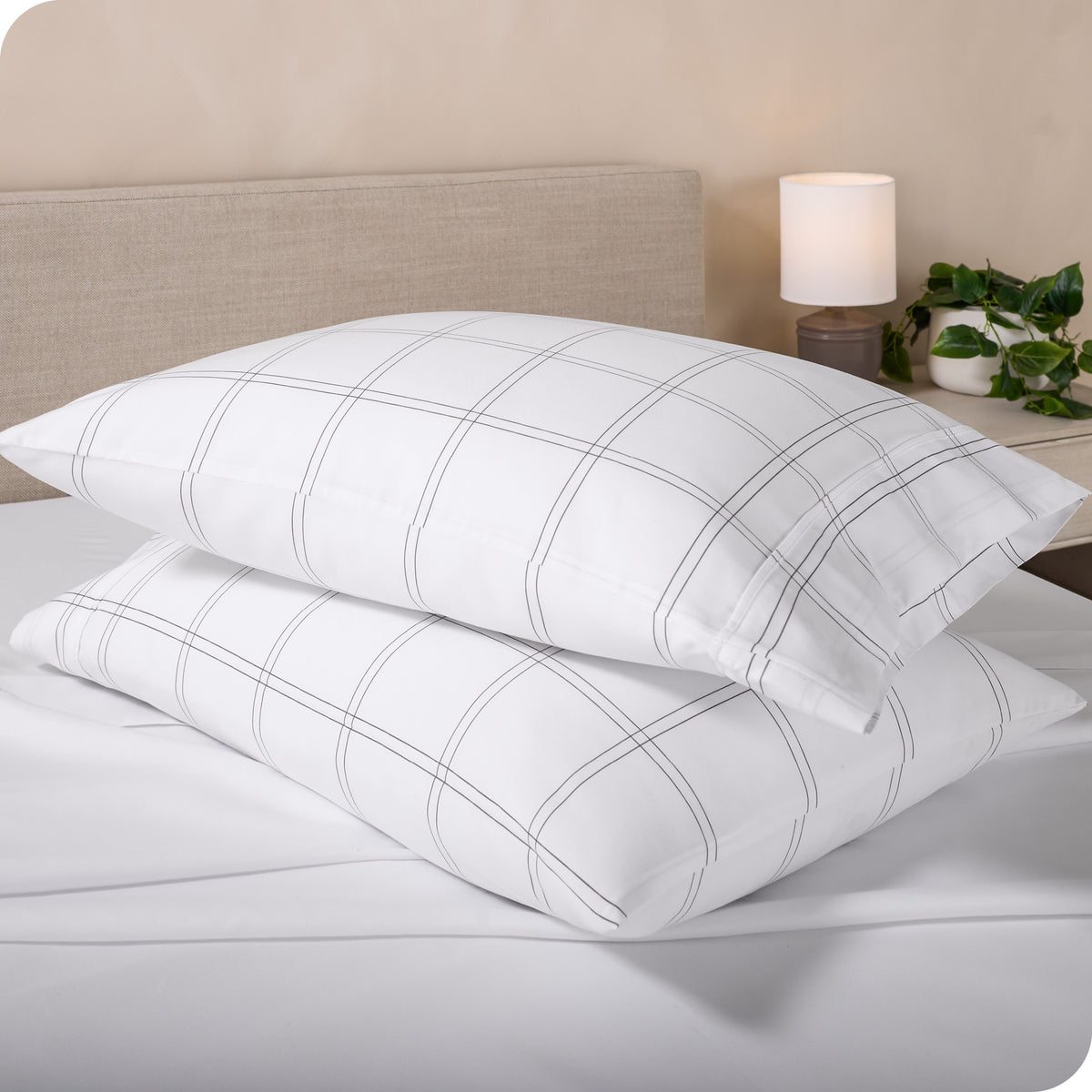Printed pillowcases and matching sheets on a bed