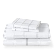 Plaid sheet set folded and stacked