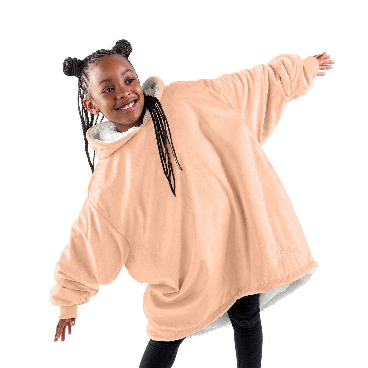 A child with a sherpa wearable blanket on