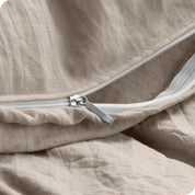 Close up of the zipper on the duvet cover partially opened