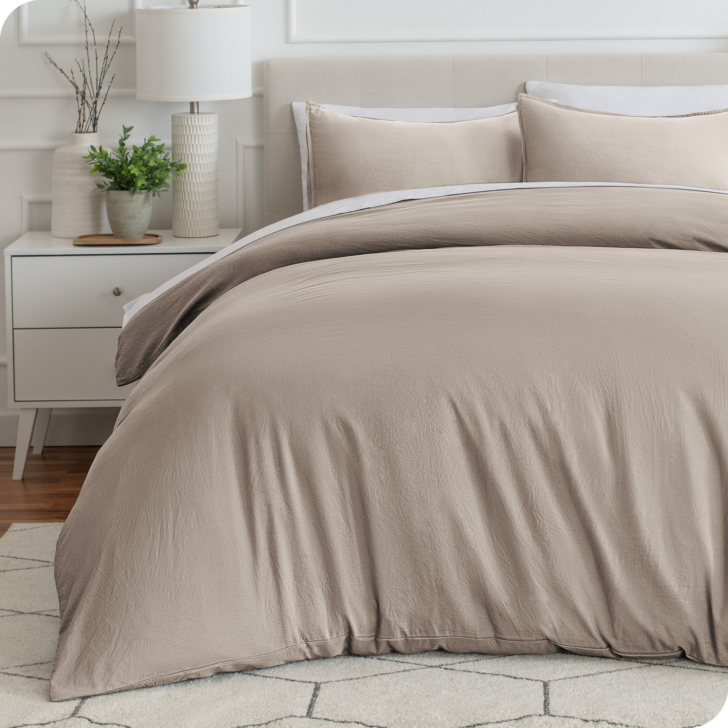 Relaxing room scene with Sandwashed duvet cover laid out over the bed