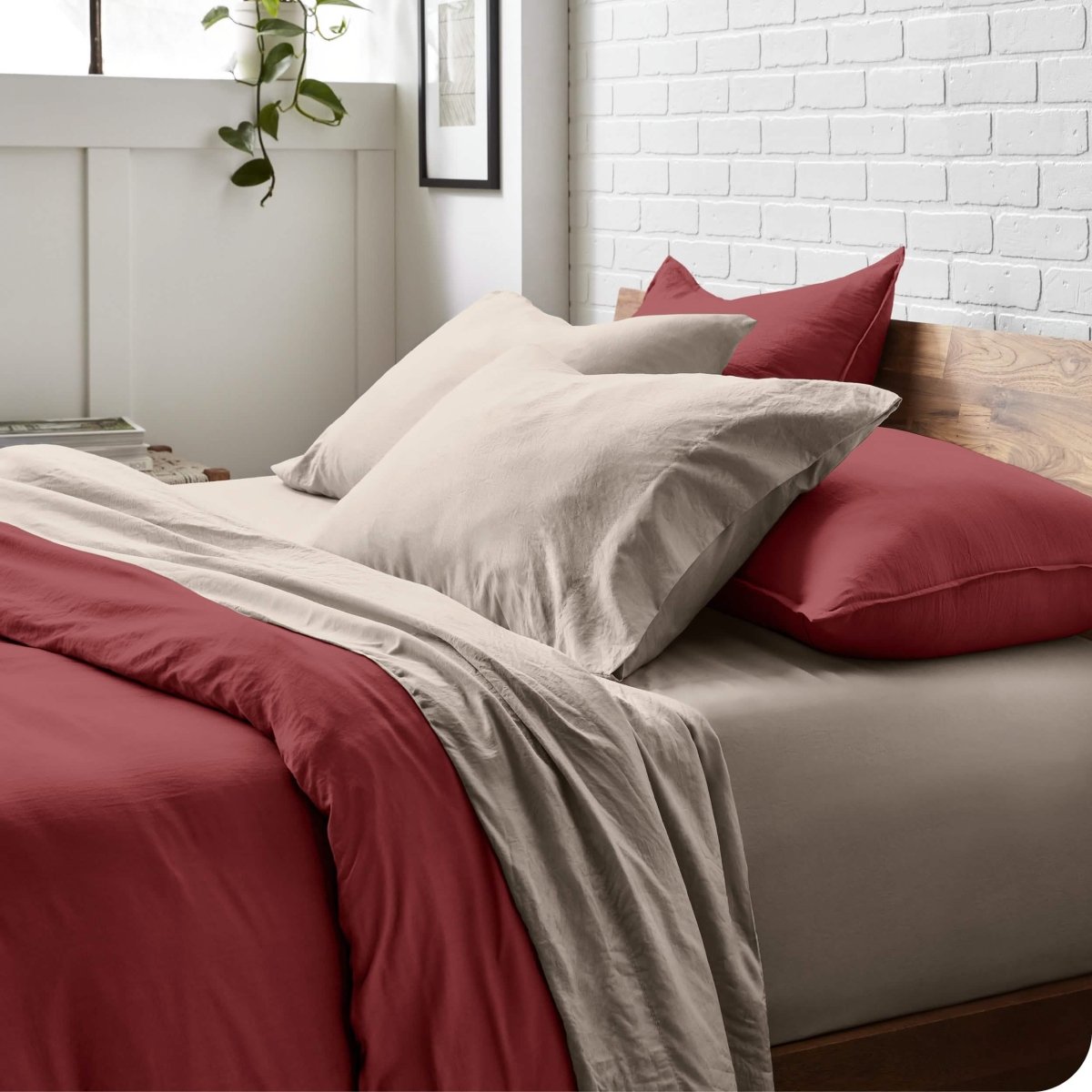 Modern bedroom with washed sheets and duvet cover on a bed