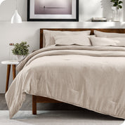 Modern bedroom with a heathered complete bedding set on the bed