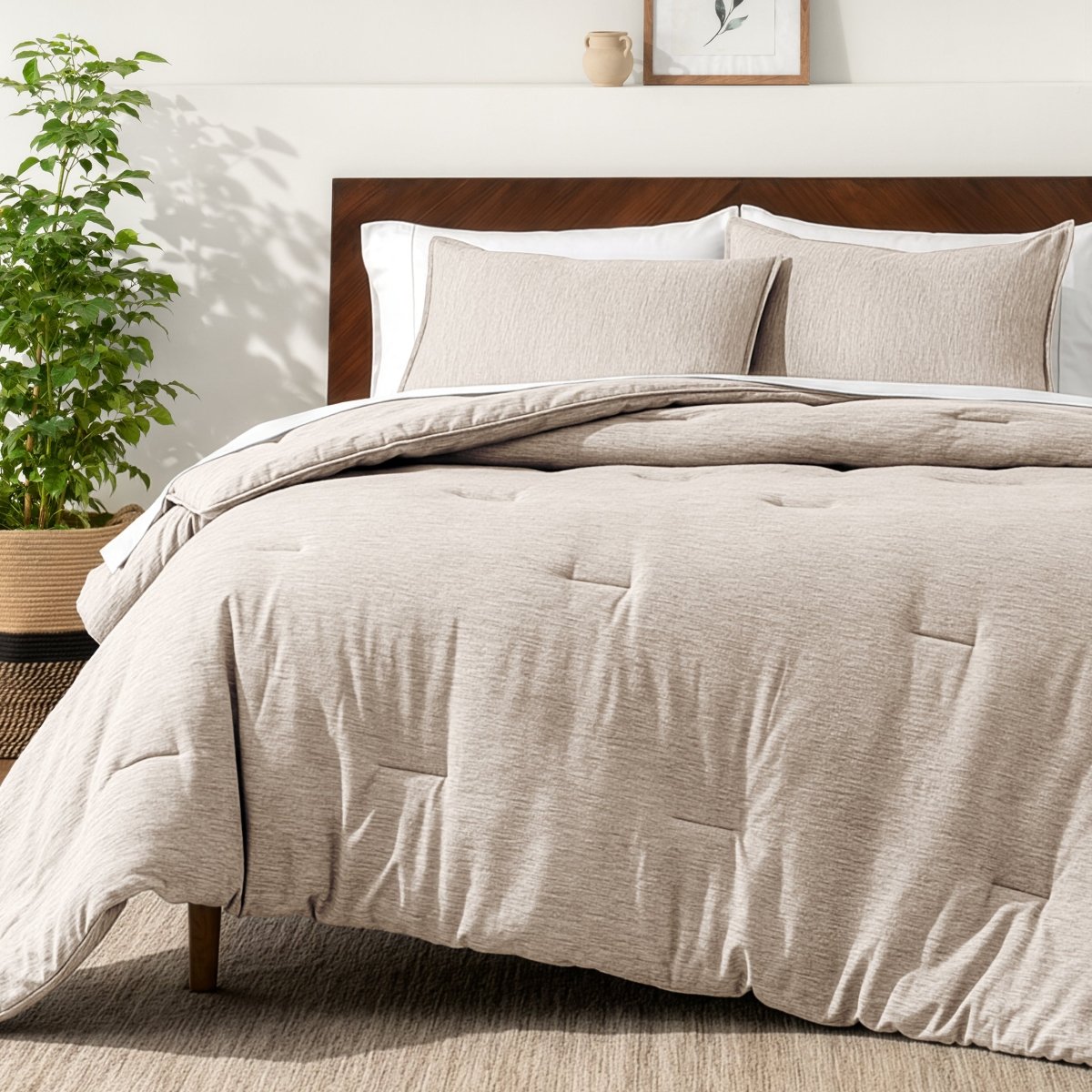 Bedding set on a bed in a bedroom with a side table and lamp.