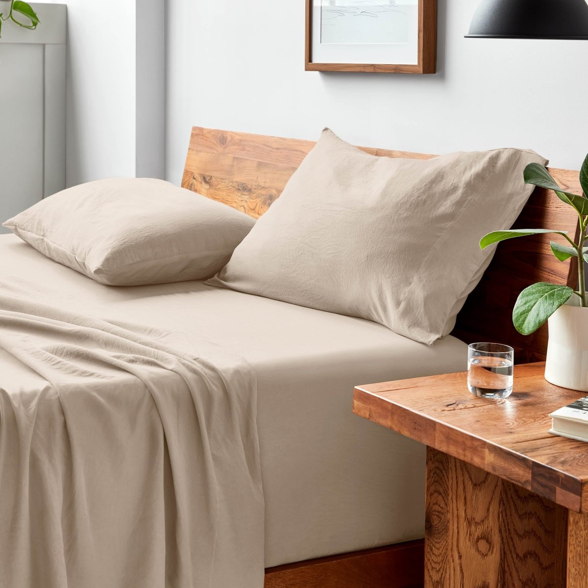 Bed with microfiber bedding and pillows in a bedroom setting