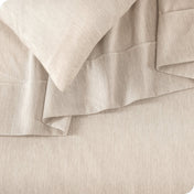 Close up of a heather sheet set on a bed