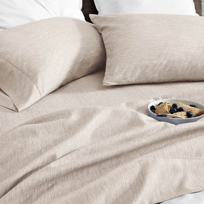 Ultra soft sheet set with a bowl of food on a bed