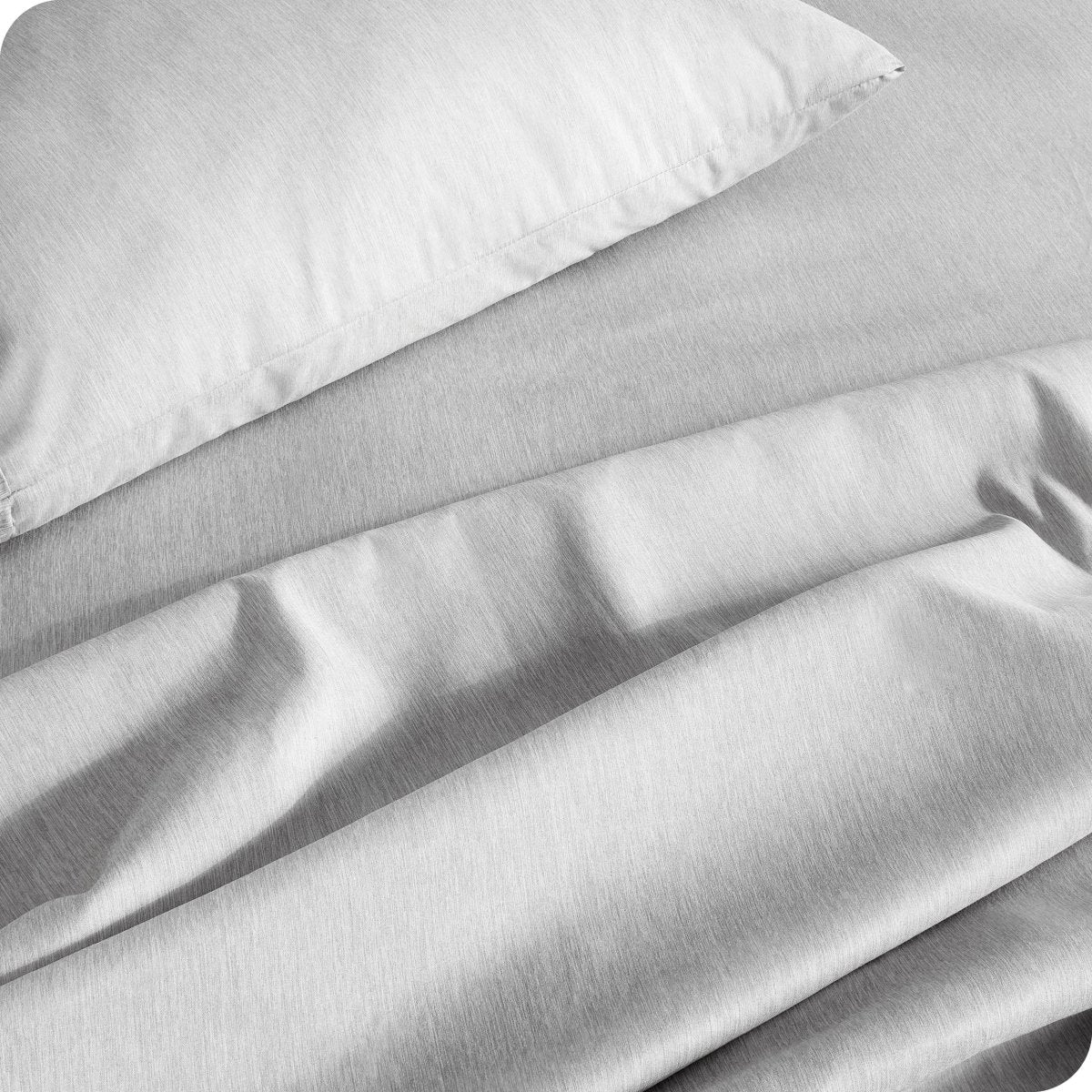Close up of a heather sheet set on a bed