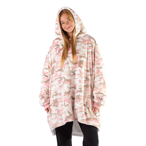 An adult with a sherpa wearable blanket on