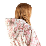 An adult with a sherpa wearable blanket on