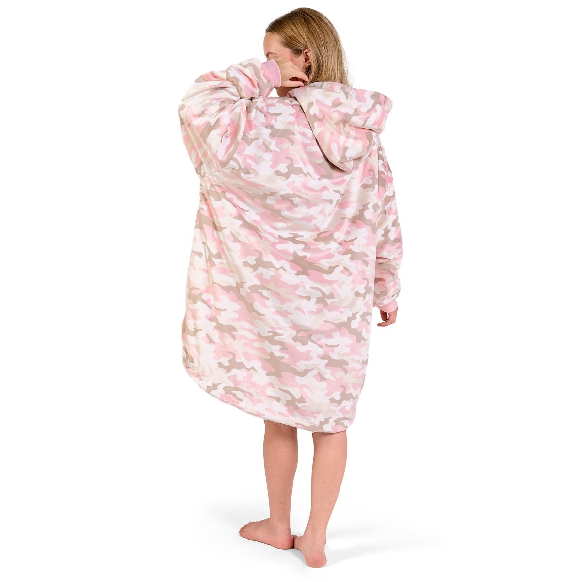 Person wearing a hooded blanket on a white background